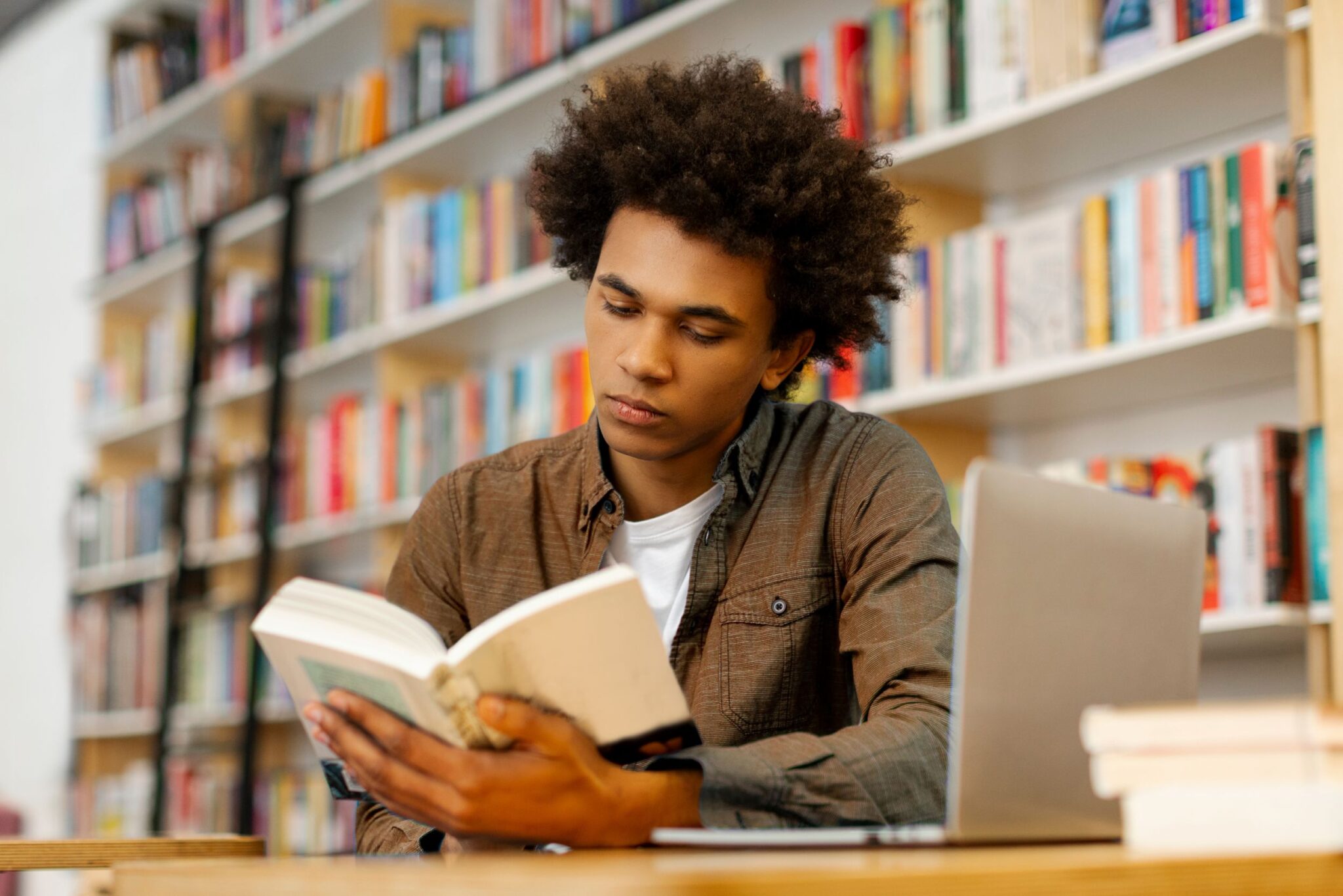 Student reading a book for functional GCSE skills.